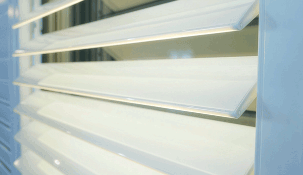 LiteLuvr louver softly glowing on a dark background