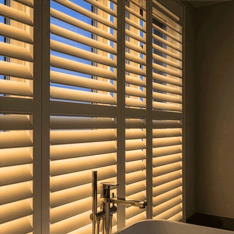Warm amber glow from LiteLüvr shutters at dusk